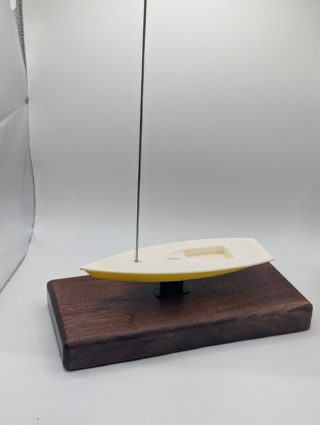 Sailboat award showing the dacron sail cut from a retired sail