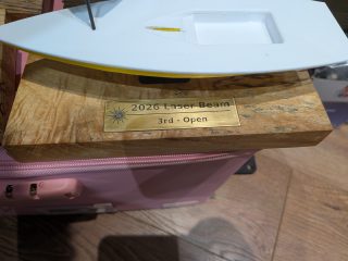 Sailboat award base detail showing the engraved brass nameplate