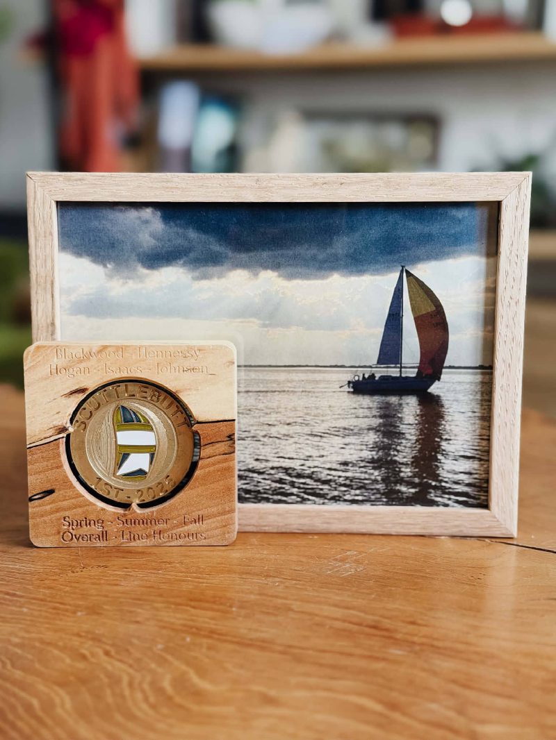 CNC engraved brass sailboat award polished to a mirror finish