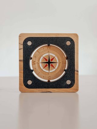 Brass award seated in its magnetic walnut display holder