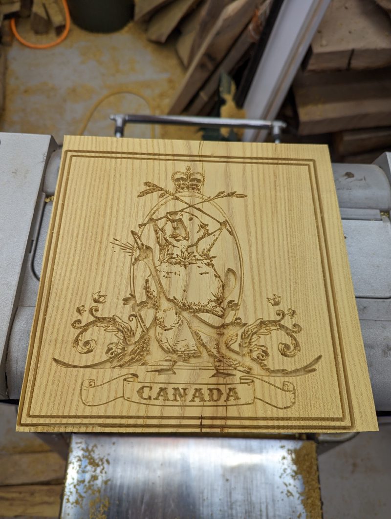 CNC v-carved Canadian coat of arms in mulberry wood