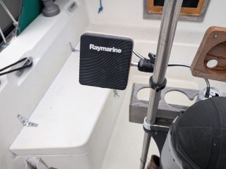 Raymarine display with protective cover on the custom mount