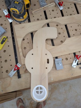 Raw CNC-cut binnacle mount on the workbench