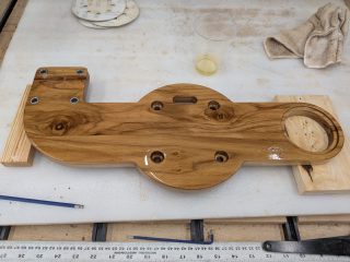 Finished teak binnacle mount showing the grain and oil finish