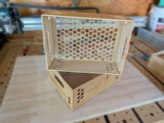 Produce boxes at different angles showing the honeycomb bottom and handle cutouts