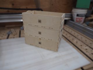 Stack of three project boxes with custom branding