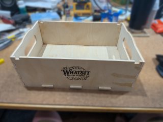 Project box with Whatsit Manufacturing Co. logo engraved on the side
