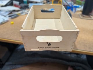 Project box showing the W monogram and handle cutout